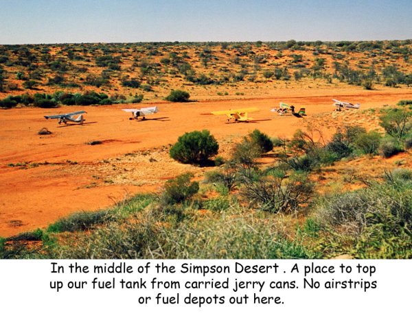 A fuel stop from carried jerry cans in the heart of the Simpson Dessert.