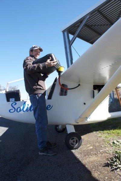 Tomo and his so called homemade "Gizmo" for filling up the fuel tank