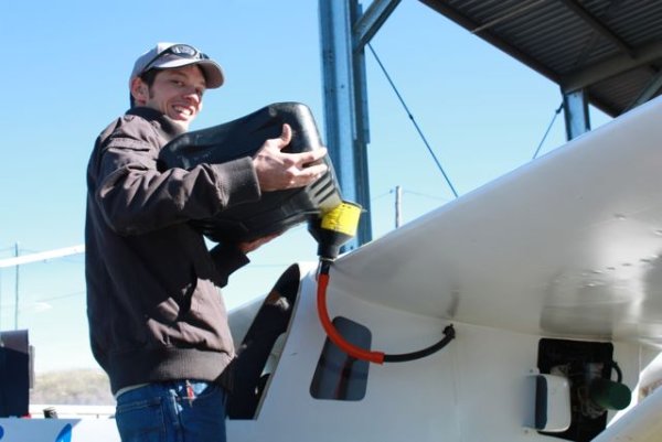 Tomo and his so called homemade "Gizmo" for filling up the fuel tank