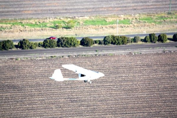 From this angle, it looks like Tomo is racing the red car on the road!